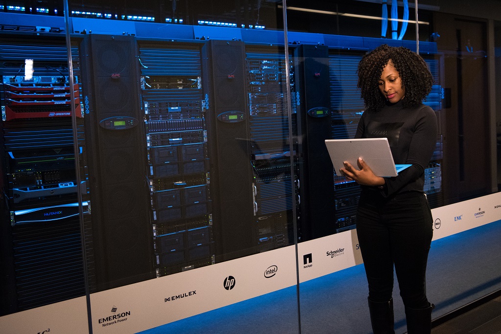 Person standing near a data center hosting web sites